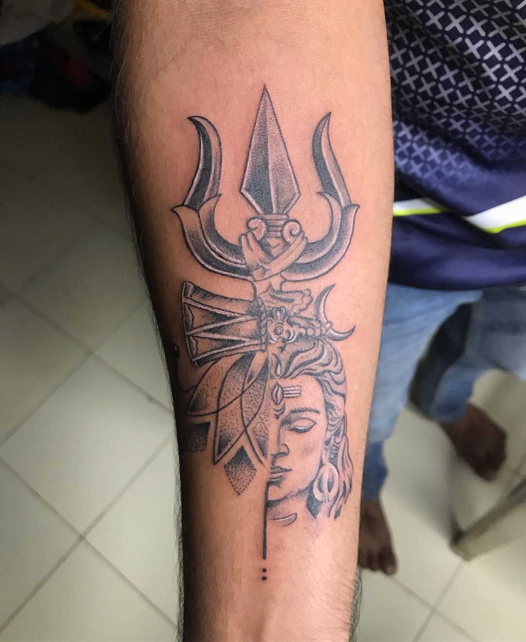 Another cool design would be Shivas Trishul and damru tattooBLACK   GREY SHIVA TRISHUL TATTOO 