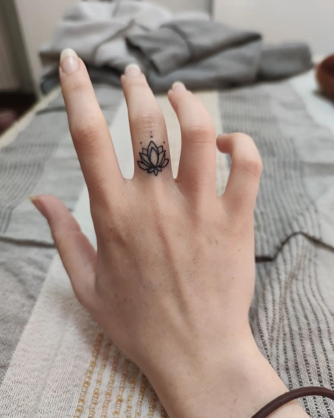 Tattoo uploaded by emma b  Geometric small flower finger tattoo  Tattoodo