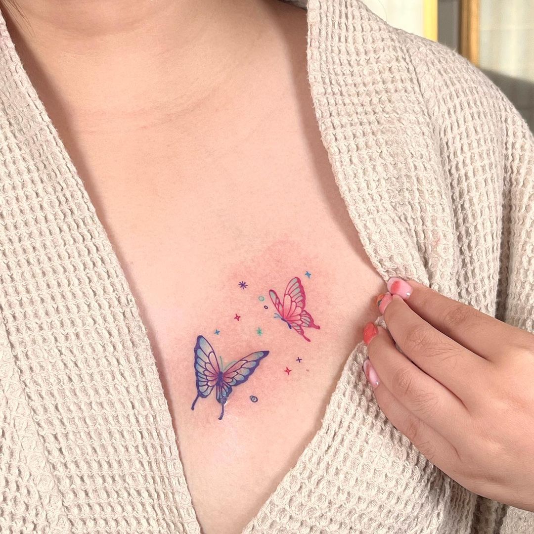 Colorful small butterfly chest tattoos